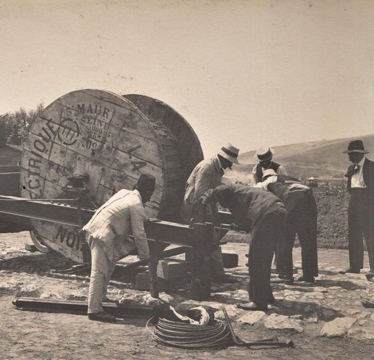 Figure 1. This image belongs to a series of photographs taken during the construction of electric infrastructure in Istanbul, ca. 1912–1913. Installation of the cable unwinding from the electric reel to the duct, 13 August 1912. From the private collection of Cengiz Özkarabekir.