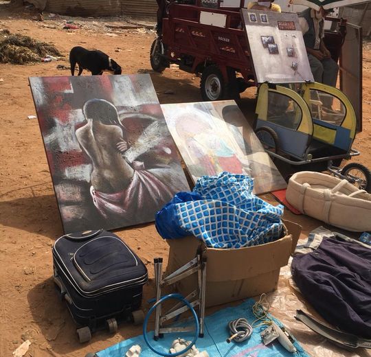 Paintings thrown on the ground amidst other diverse consumables at Souk Smara (Sale), 9 August 2020. Photo by author.