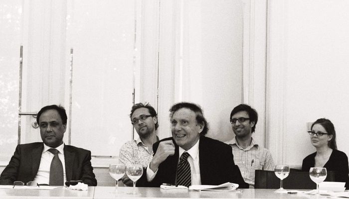 Participants listening and laughing.