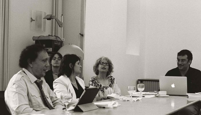 Participants listening to a speaker.