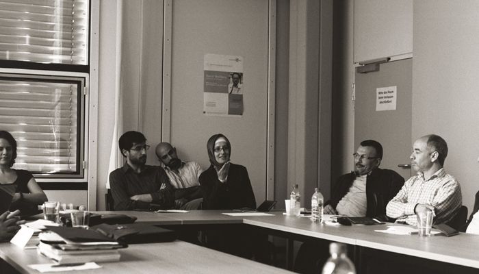 Participants in a seminar setting.